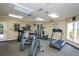 Community gym with modern exercise equipment including treadmills, bikes, and weight machines at 4008 Crockers Lake Blvd # 11, Sarasota, FL 34238