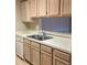 Kitchen featuring stainless steel sink and light wood cabinets at 4008 Crockers Lake Blvd # 11, Sarasota, FL 34238