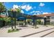 Inviting patio area with stylish pergola, seating, and lush landscaping perfect for outdoor relaxation at 4008 Crockers Lake Blvd # 11, Sarasota, FL 34238