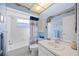Bright bathroom with nautical themed shower curtain and modern fixtures at 4050 Oakhurst Dr # 3175, Sarasota, FL 34233