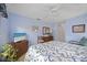 Calm bedroom with soft blue walls, closet, bureau and seashell bedding at 4050 Oakhurst Dr # 3175, Sarasota, FL 34233