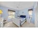 Bright bedroom featuring a white bed frame, matching dresser, and natural light at 4050 Oakhurst Dr # 3175, Sarasota, FL 34233