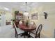 Cozy dining area featuring a wooden table set with four chairs, alongside a classic china cabinet at 4050 Oakhurst Dr # 3175, Sarasota, FL 34233