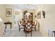 Charming dining room with a traditional wood table and chairs, complemented by elegant lighting and decor at 4050 Oakhurst Dr # 3175, Sarasota, FL 34233