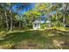 Charming gazebo nestled among trees and a well-maintained lawn, creating a serene and inviting outdoor space at 4050 Oakhurst Dr # 3175, Sarasota, FL 34233