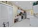 Bright kitchen features white cabinets, tile flooring, and modern appliances at 4050 Oakhurst Dr # 3175, Sarasota, FL 34233