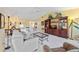 Well-lit living room with a vaulted ceiling, plush seating, and a view into the dining area for easy entertaining at 4050 Oakhurst Dr # 3175, Sarasota, FL 34233