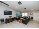 Community living room with comfortable seating, a large TV, and stylish decor for a relaxing atmosphere at 4050 Oakhurst Dr # 3175, Sarasota, FL 34233