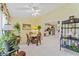 Sun Room is furnished with wicker furniture and tiled flooring with access to kitchen at 4050 Oakhurst Dr # 3175, Sarasota, FL 34233