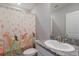 A bathroom features a granite countertop and a Princess themed shower curtain at 411 158Th E St, Bradenton, FL 34212