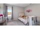 This bedroom has a large window and is well decorated with Princess themed decor at 411 158Th E St, Bradenton, FL 34212
