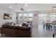 Cozy living room with a large sectional couch, tiled floors, and views to the outside at 411 158Th E St, Bradenton, FL 34212