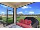 A screened-in patio offers a view of the large fenced-in backyard at 411 158Th E St, Bradenton, FL 34212