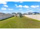 Backyard featuring an open grassy area, a playset, and a full perimeter fence at 4205 Willow Hammock Dr, Palmetto, FL 34221