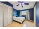 Cozy blue bedroom with bright white bedding at 4335 Maceachen Blvd, Sarasota, FL 34233