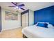Stylish bedroom featuring a bright blue accent wall at 4335 Maceachen Blvd, Sarasota, FL 34233