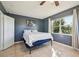 Bedroom with tile floors, ample lighting, and a window that brings the outdoors inside at 4335 Maceachen Blvd, Sarasota, FL 34233