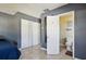 Bedroom featuring tile floors, closet, and doorway to adjacent bathroom at 4335 Maceachen Blvd, Sarasota, FL 34233