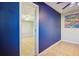 Bright blue bedroom featuring tiled flooring at 4335 Maceachen Blvd, Sarasota, FL 34233