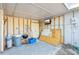 Partially covered garage with ladder, grill, and storage at 4335 Maceachen Blvd, Sarasota, FL 34233