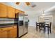 Spacious kitchen area with stainless steel appliances and seamless transition to dining space at 4335 Maceachen Blvd, Sarasota, FL 34233
