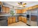 Contemporary kitchen space with stainless steel appliances and ample cabinet storage at 4335 Maceachen Blvd, Sarasota, FL 34233