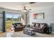 Living room showcasing tile floors, natural light, and comfortable seating at 4335 Maceachen Blvd, Sarasota, FL 34233