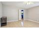 Living room features tiled floor, neutral walls, and ceiling fan at 4335 Maceachen Blvd, Sarasota, FL 34233