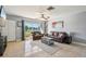 Inviting living room featuring tile floors, recessed lighting, and comfortable seating arrangements at 4335 Maceachen Blvd, Sarasota, FL 34233