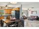 Open-concept layout combining a cozy living room with an adjacent kitchen and dining area at 4335 Maceachen Blvd, Sarasota, FL 34233
