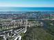 A beautiful aerial view of a coastal neighborhood with waterfront homes and access to the ocean at 441 Rubens E Dr, Nokomis, FL 34275