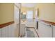 Well-lit bathroom with a glass door shower, white vanity, and coordinated decor at 441 Rubens E Dr, Nokomis, FL 34275