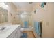 Bathroom featuring vanity, glass door shower/tub, and nautical wall decorations at 441 Rubens E Dr, Nokomis, FL 34275