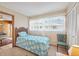 Cozy bedroom with ample light, closet, view of the street, and view of the living room at 441 Rubens E Dr, Nokomis, FL 34275
