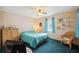 Comfortable bedroom with a ceiling fan, shelving, and a serene window view at 441 Rubens E Dr, Nokomis, FL 34275