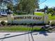 A welcoming entrance sign to Sorrento East community with manicured landscaping and a sunny day at 441 Rubens E Dr, Nokomis, FL 34275