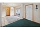 Open dining room with white tile flooring, area rug, and access to the screened patio at 441 Rubens E Dr, Nokomis, FL 34275