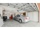 Spacious garage with ample storage space, a parked sedan, and a functional layout at 441 Rubens E Dr, Nokomis, FL 34275