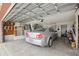Well-organized garage space featuring a parked sedan and plenty of room for storage at 441 Rubens E Dr, Nokomis, FL 34275