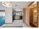 Bright kitchen with a skylight, black appliances, and a tiled floor at 441 Rubens E Dr, Nokomis, FL 34275
