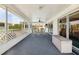 Covered patio features an outdoor dining area and ample space for relaxing and entertaining guests at 441 Rubens E Dr, Nokomis, FL 34275