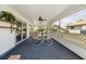 This covered patio is perfect for enjoying outdoor meals with a view of the pool and backyard at 441 Rubens E Dr, Nokomis, FL 34275