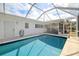 Relaxing pool features a screened enclosure, perfect for enjoying a swim while staying cool and comfortable at 441 Rubens E Dr, Nokomis, FL 34275