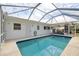 Enjoy your private swimming pool with screened-in enclosure, patio and access to the house at 441 Rubens E Dr, Nokomis, FL 34275