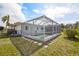 Screened-in pool in backyard provides a refreshing oasis for relaxation and entertaining at 441 Rubens E Dr, Nokomis, FL 34275