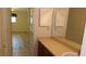 Bathroom featuring vanity with ample counter space and drawer storage, with a view into a bedroom space at 4412 Spicewood Dr # D, Bradenton, FL 34208