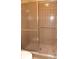 Shower stall with glass sliding doors and grab bar inside of a bathroom setting at 4412 Spicewood Dr # D, Bradenton, FL 34208