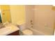 Bright bathroom features a shower-tub combo with a single vanity and neutral tile flooring at 4412 Spicewood Dr # D, Bradenton, FL 34208