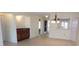 Dining area showcasing ceramic tile flooring, a wet bar, and views into adjacent rooms at 4412 Spicewood Dr # D, Bradenton, FL 34208