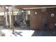 Condo exterior with a carport, stairs, and lush landscaping at 4412 Spicewood Dr # D, Bradenton, FL 34208